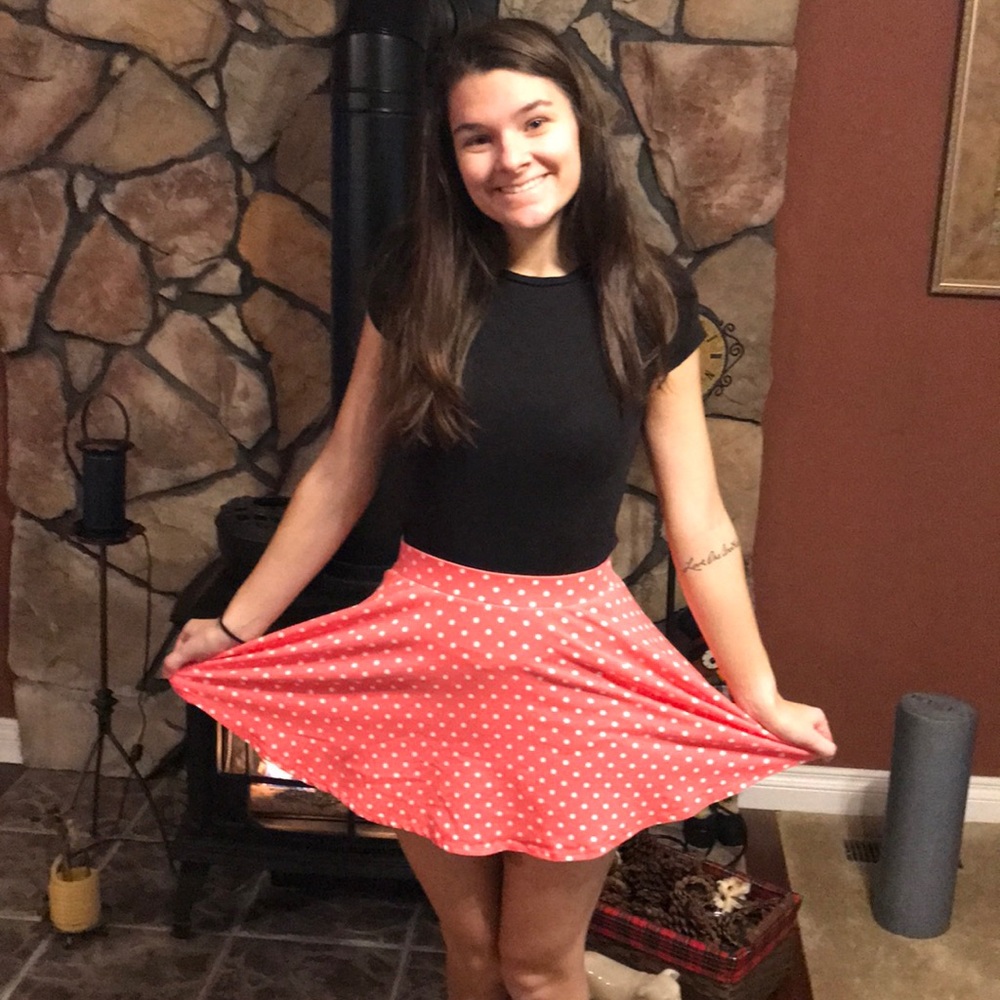 Fun and vibrant orange polka dotted mini skirt